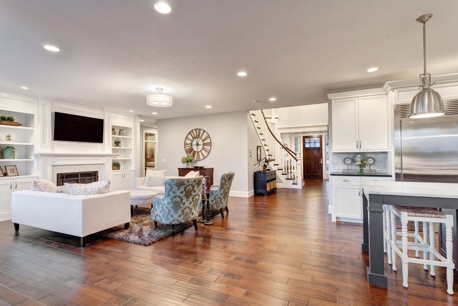 An open living space featuring in-ceiling lighting fixtures.