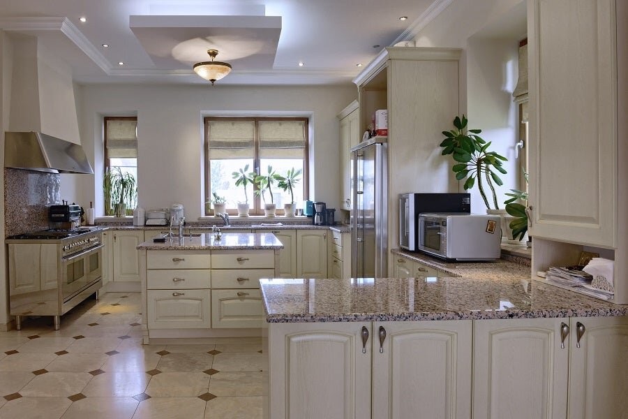 A kitchen space illuminated by smart lighting fixtures.