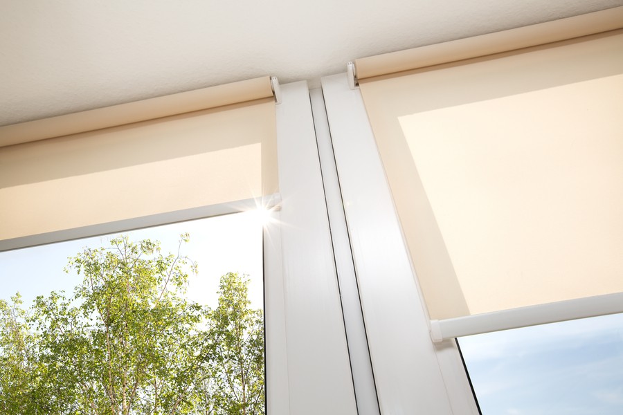 motorized shades installed on glass windows