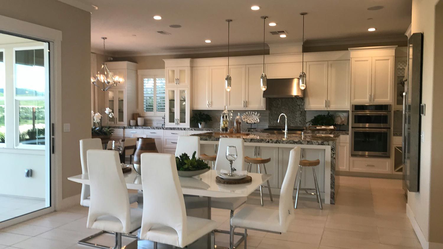 Kitchen with white cabinets and pendant lighting